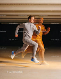Athletic man running indoors with dynamic motion effect