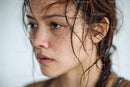 Close-up of a Wet-Haired Woman with Freckles and Natural Skin