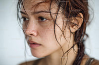 Close-up of a Wet-Haired Woman with Freckles and Natural Skin