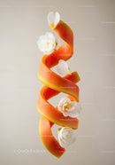 Spiral papaya peel decorated with white flowers