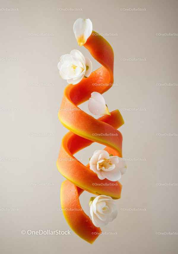 Spiral papaya peel decorated with white flowers