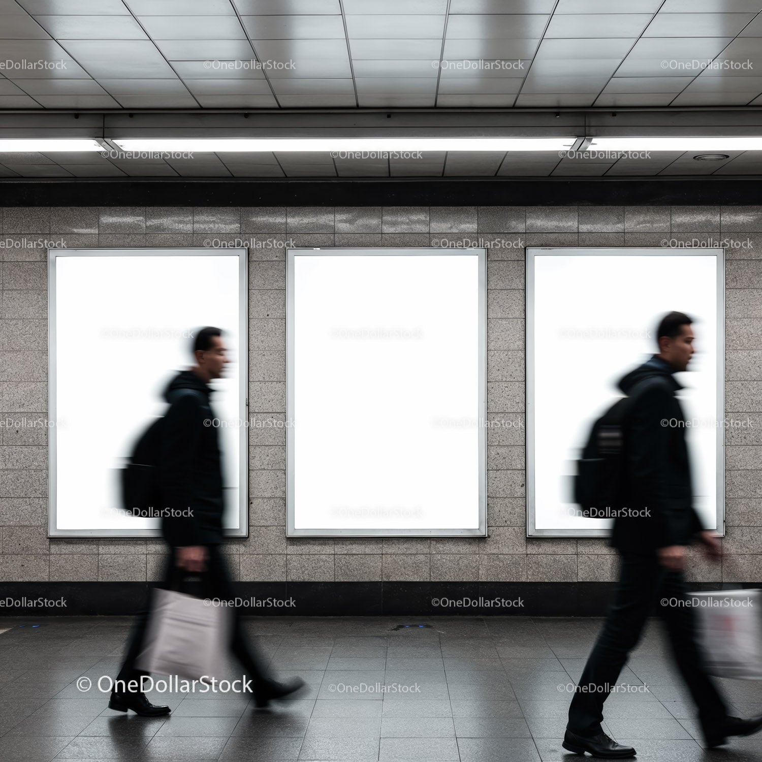 Blurred commuters walking past blank urban billboards