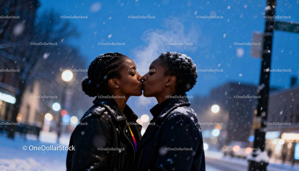 Couple sharing a tender kiss on snowy winter evening