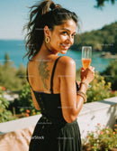 Young Woman Relaxing Outdoors with Cocktail and Beach View