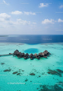Overwater Bungalows in Turquoise Lagoon with Crystal Clear Water