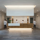 Modern reception desk in minimalist wellness center lobby