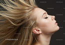 Blonde woman with flowing hair and closed eyes profile