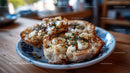 Roasted Garlic Cloves with Rosemary on Rustic Wooden Table