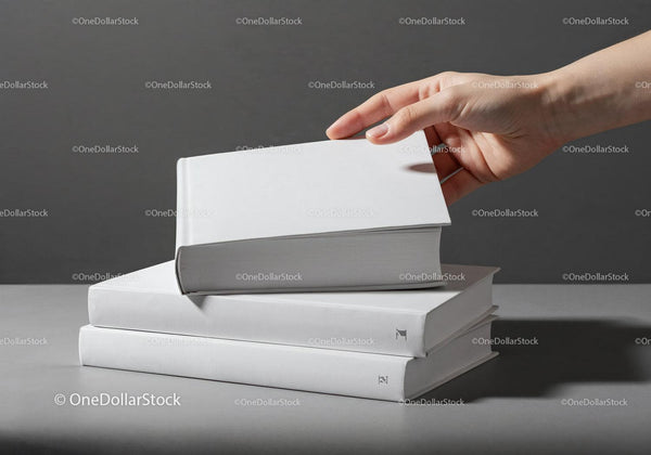 Hand Picking a Book from a Stack of White Hardcover Books JPG Mockup Image