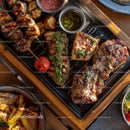 Assorted Grilled Meat Skewers and Vegetables on a Wooden Serving Tray