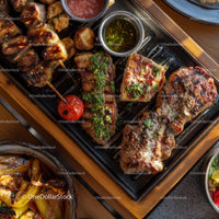 Assorted Grilled Meat Skewers and Vegetables on a Wooden Serving Tray