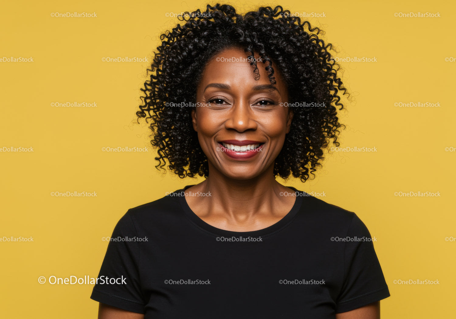 Portrait of a Smiling African American Woman with Curly Hair on Yellow Background