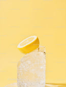 Fresh lemon slice on clear melting ice cube