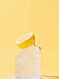 Fresh lemon slice on clear melting ice cube