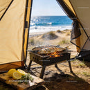 Fresh Fish Grilling on Portable BBQ by Seaside Tent