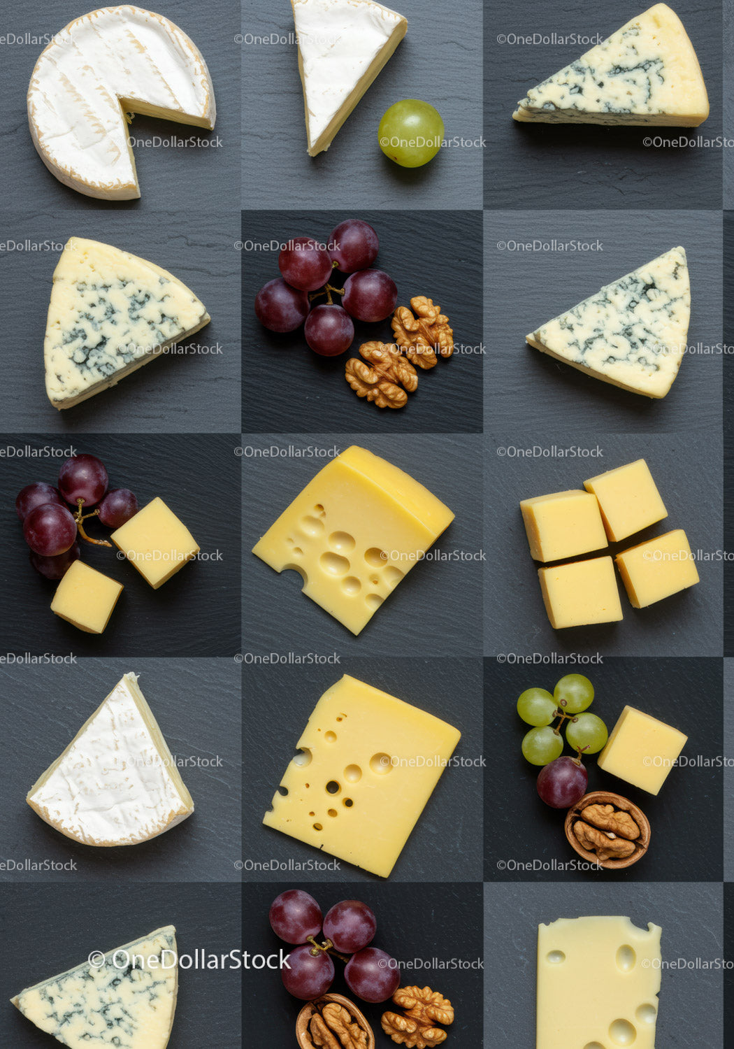 Assorted cheeses with grapes and walnuts on slate board