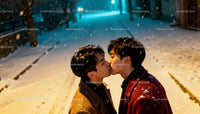 Young couple sharing a tender kiss in snowy night