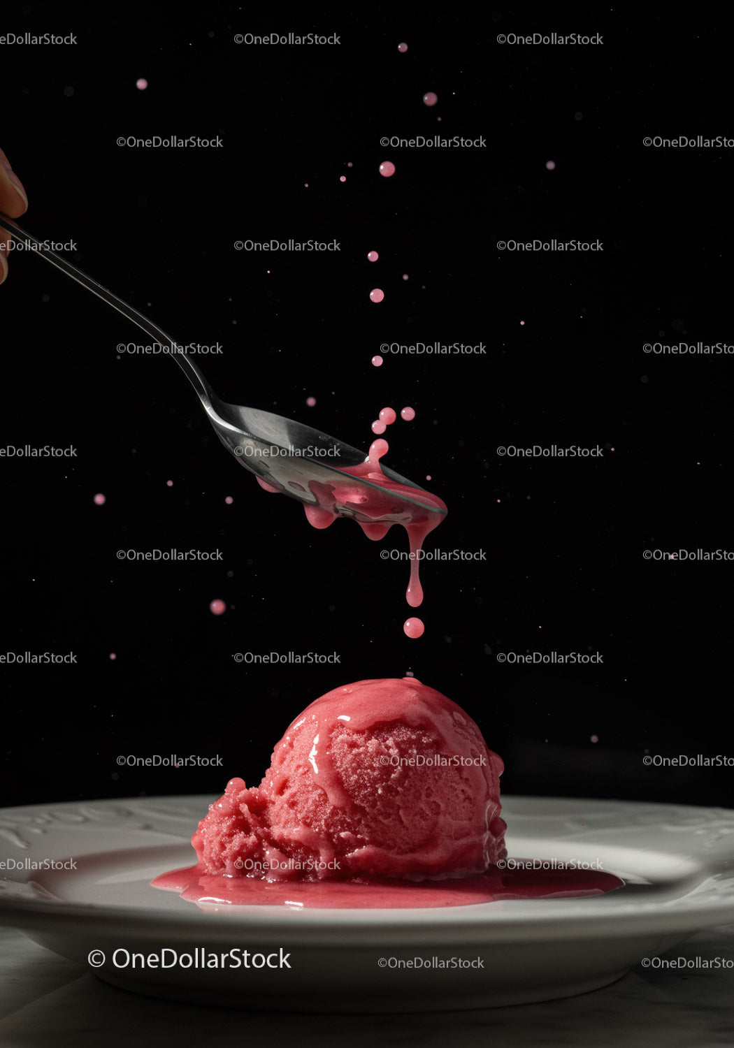 Dripping raspberry sauce over vibrant sorbet scoop