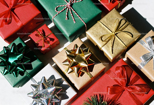 Colorful wrapped Christmas gifts with festive ribbons