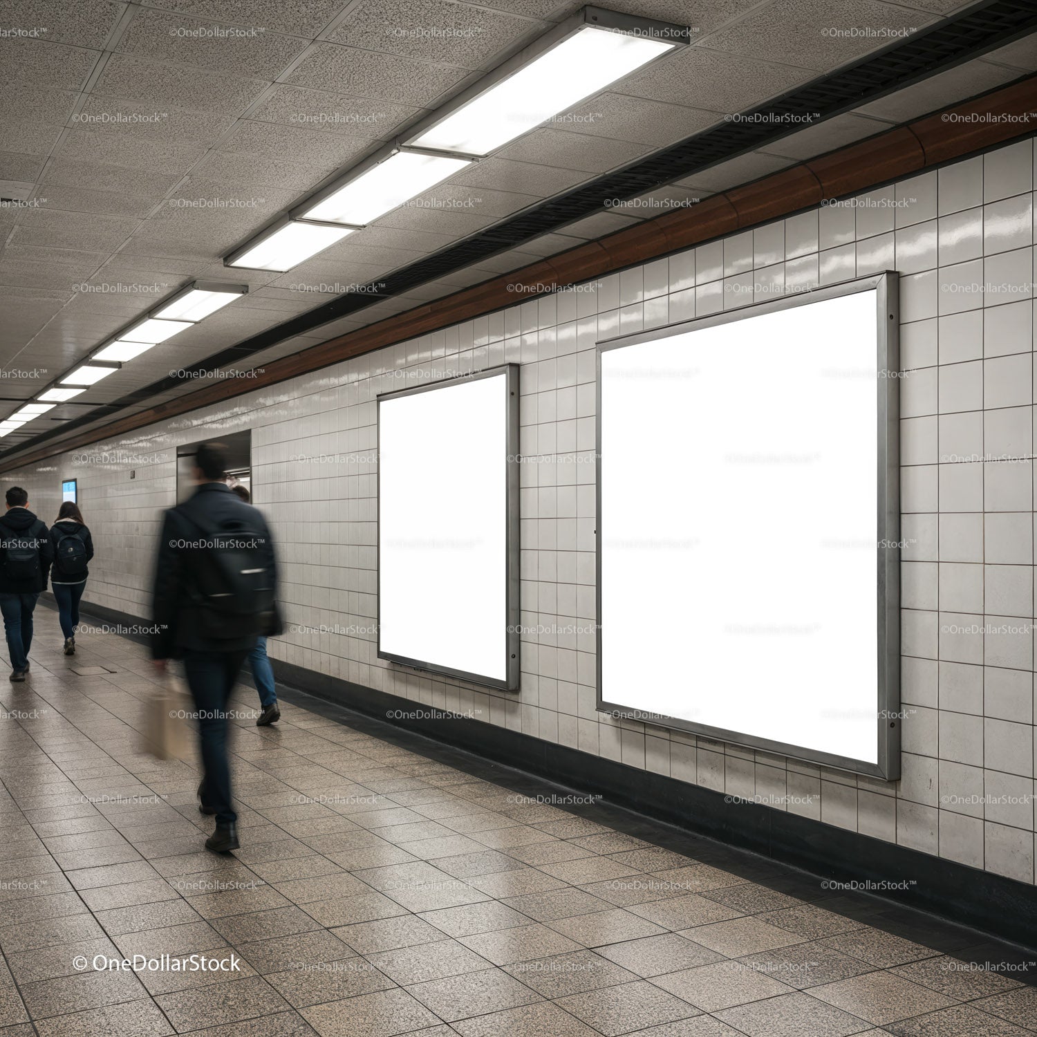 People Walking Past Blank Advertising Posters in Subway