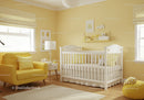 Bright Yellow and White Nursery Room with Baby Furniture and Decor
