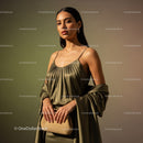 Elegant Woman Wearing Beige Satin Dress with Jewelry and Clutch Bag