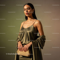 Elegant Woman Wearing Beige Satin Dress with Jewelry and Clutch Bag