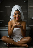 Young Woman Relaxing with Facial Mask and Towel Wrapped Hair