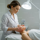 Woman Receiving Facial Treatment in Spa Wellness Center