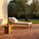 Elegant Wooden Lounge Chair in Sunlit Garden with Trees and Cozy Decor