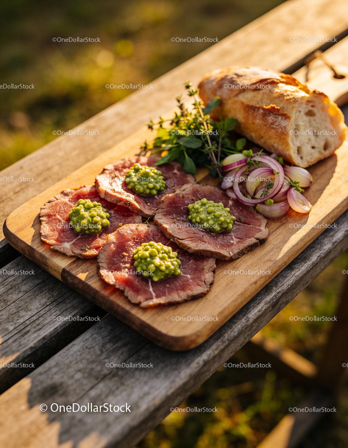 Tender beef carpaccio with herbs and fresh bread