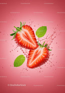 Fresh strawberry halves with mint leaves and water splash
