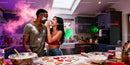 Couple Playfully Baking Heart Cookies in Cozy Kitchen