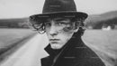 Black Hat Rainy Day Portrait of a Young Man in Moody Outdoor Scene