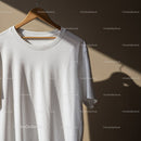 Minimalist White T Shirt Hanging on Wooden Hanger