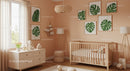 Modern Nursery Room with Wooden Furniture and Tropical Monstera Wall Art