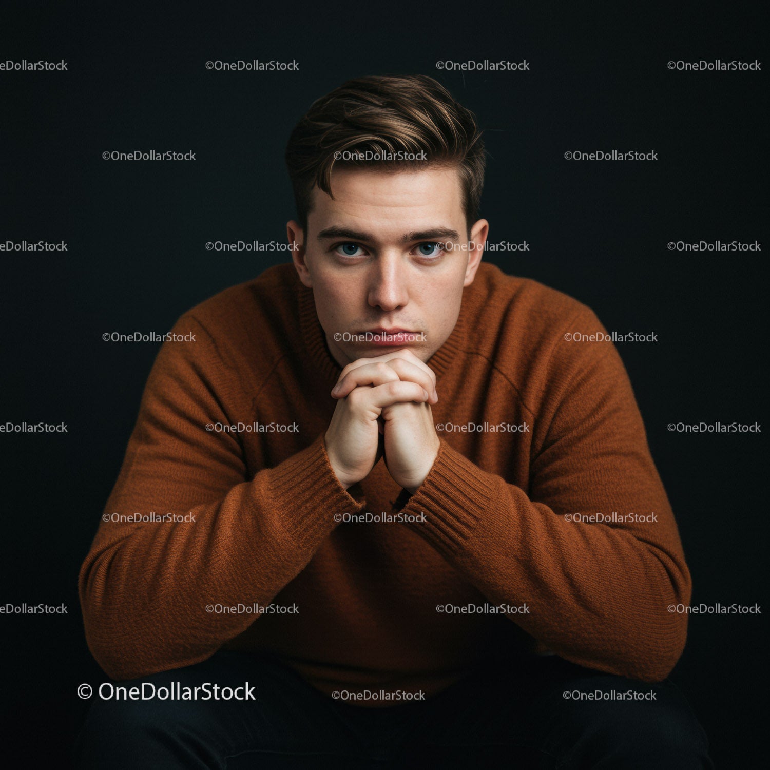 Portrait of Young Man in Brown Sweater with Thoughtful Expression
