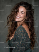 Joyful Woman with Long Wavy Hair Wearing Glitter Dress