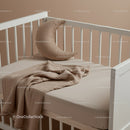 Minimalist Baby Crib with Moon Pillow and Cozy Blanket