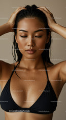 Serene Young Woman with Wet Skin in Black Bikini for Skincare and Beauty
