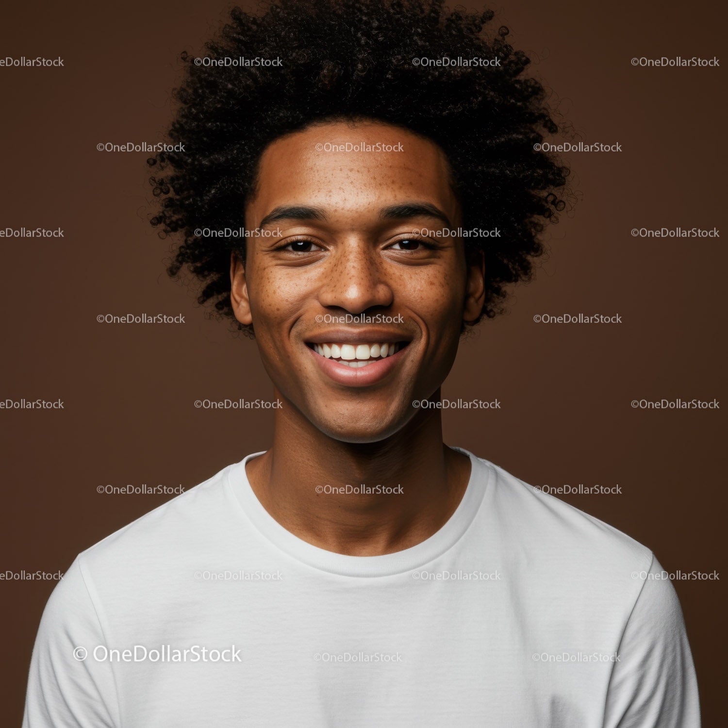 Young Man with Bright Smile and Curly Hair in Studio Portrait