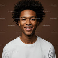 Young Man with Bright Smile and Curly Hair in Studio Portrait