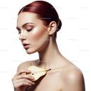 Elegant Woman with Red Hair Holding Pear in Beauty Portrait