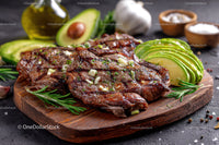 Juicy Grilled Steak with Avocado Slices and Fresh Herbs