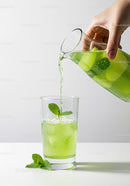Refreshing Green Lime and Mint Drink Being Poured