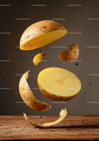 Floating potato halves and peeling floating midair