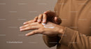 Close-Up of Person Applying Hand Lotion for Skin Care and Moisturizing