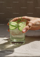 Refreshing cucumber and rosemary sparkling water glass