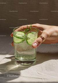Refreshing cucumber and rosemary sparkling water glass