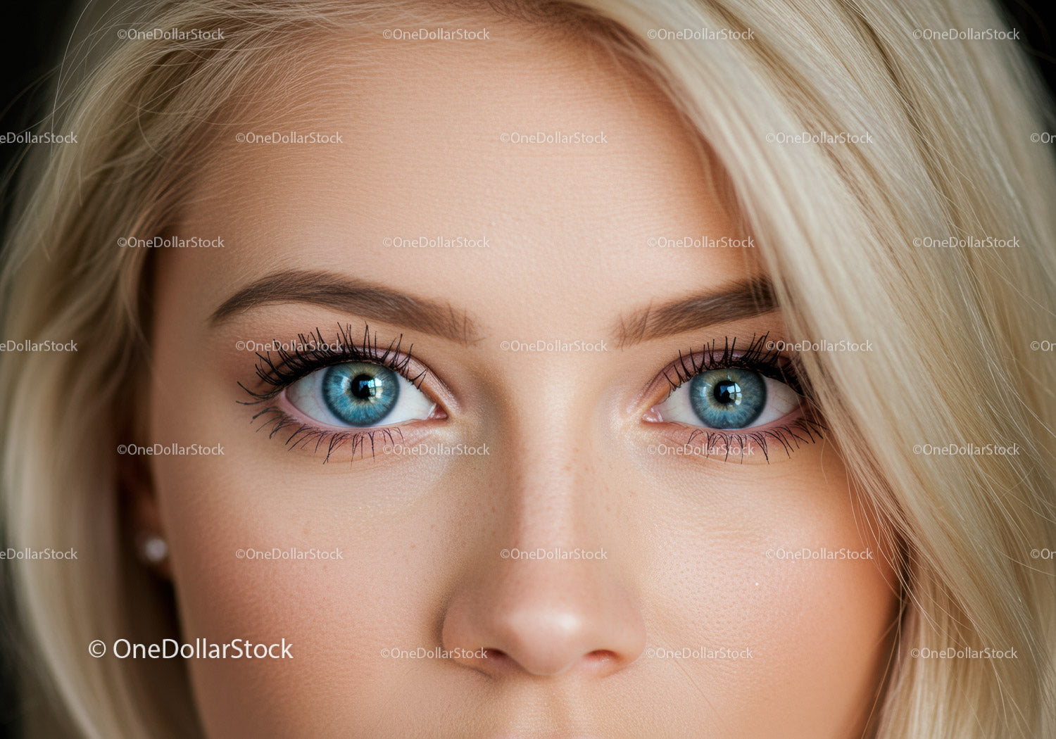 Close up of blue eyes with long lashes and blonde hair